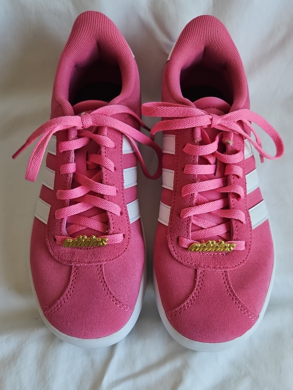 adidas Pink Sneakers with White Stripes and Gold Accents